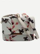 A white bag with a print of flowers and a butterfly-1