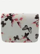 A white bag with a print of flowers and a butterfly-3