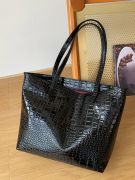 Shoulder bag with a shiny black pattern-1
