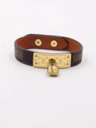 Its bracelet is Louis Vuitton brown leather-1