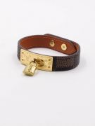 Its bracelet is Louis Vuitton brown leather-2