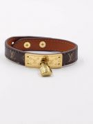 Its bracelet is Louis Vuitton brown leather-4