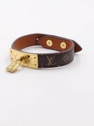 Its bracelet is Louis Vuitton brown leather-5