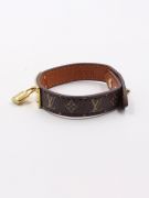 Its bracelet is Louis Vuitton brown leather-6