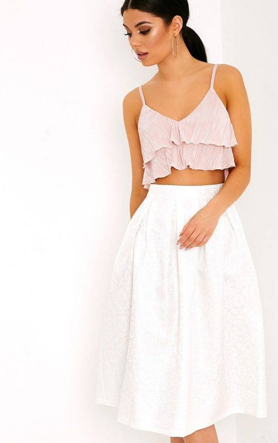 White skirt with ruffles and tassels