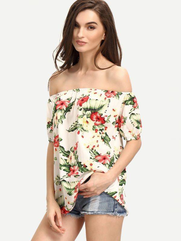 A white blouse with flower print and an open shoulder