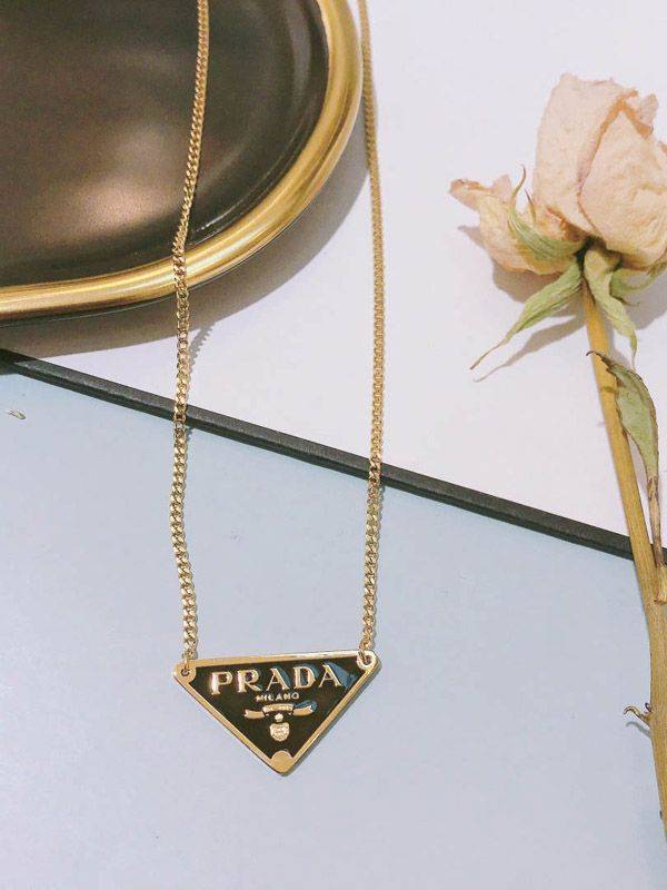 Authentic reworked small Prada tag necklace dark orange silver. | VINTY  TREASURES
