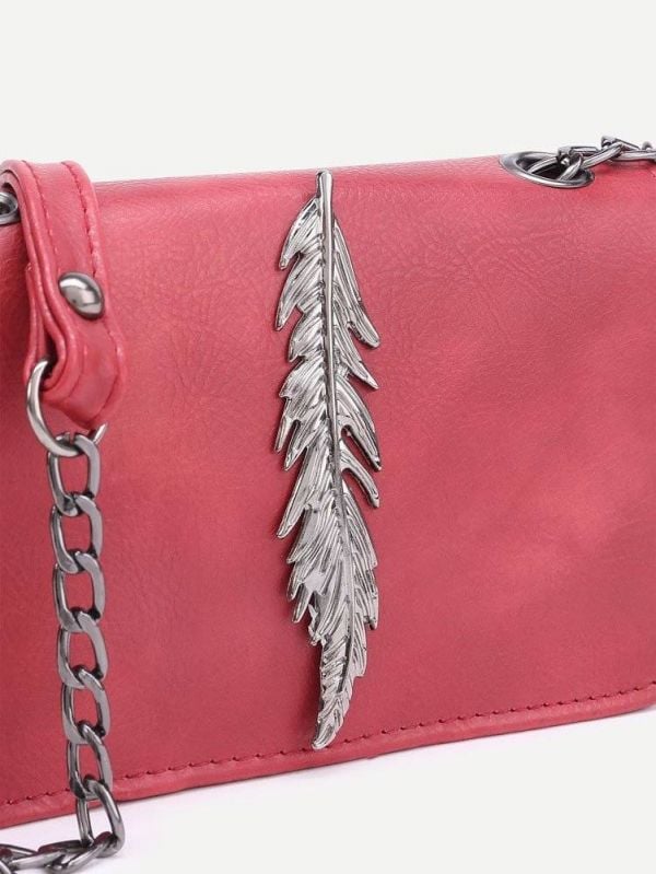 Shoulder bag decorated with metal leaf and chain