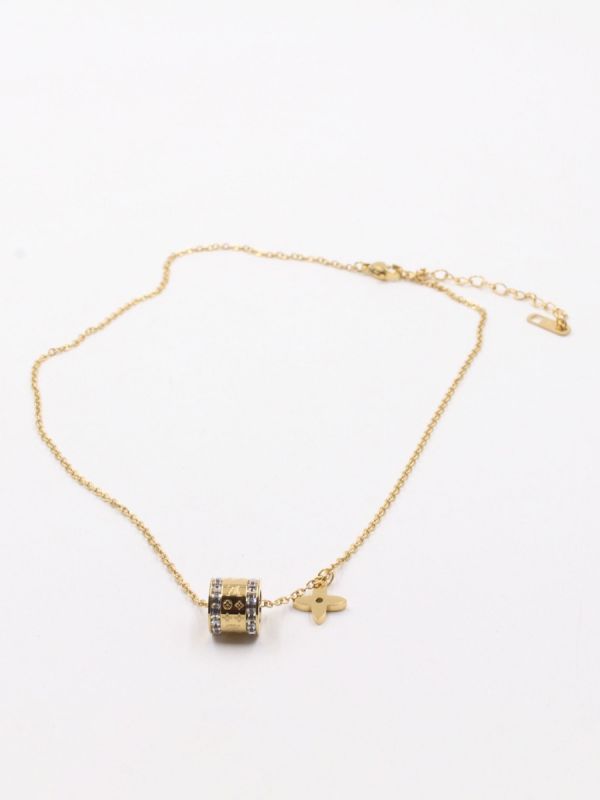 A cylindrical Louis Vuitton necklace