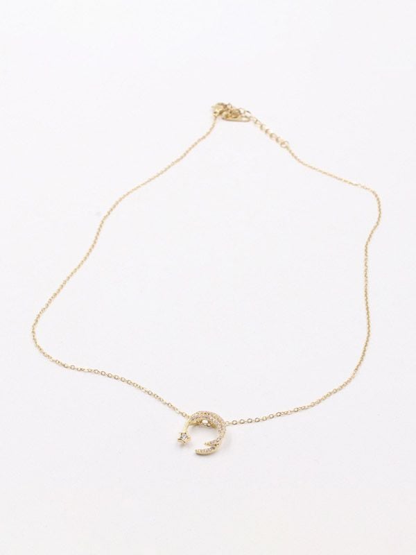 A crescent and star zircon gold chain
