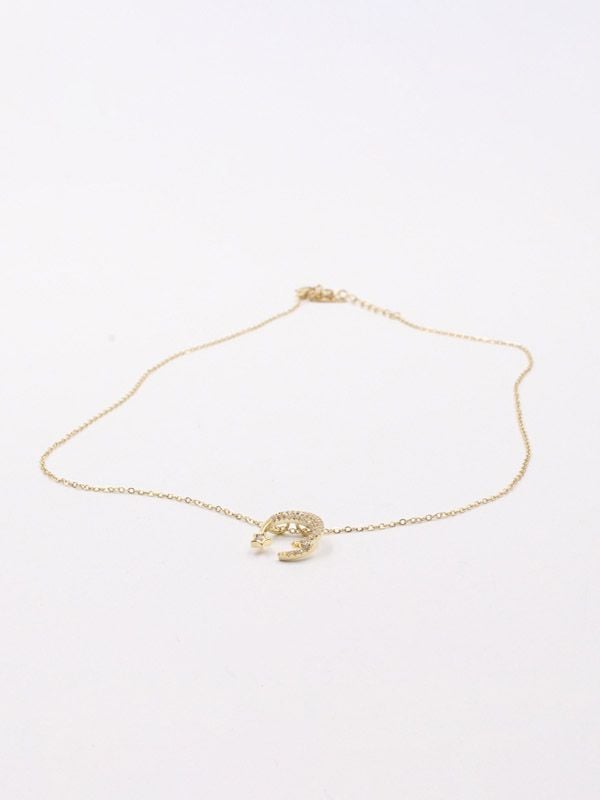 A crescent and star zircon gold chain