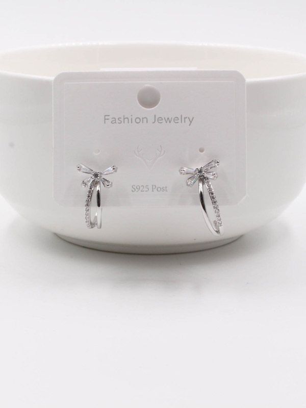 A curved butterfly zircon earring