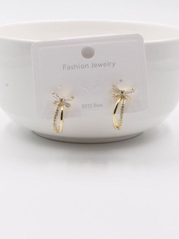 A curved butterfly zircon earring