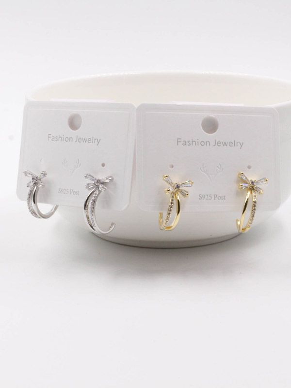 A curved butterfly zircon earring
